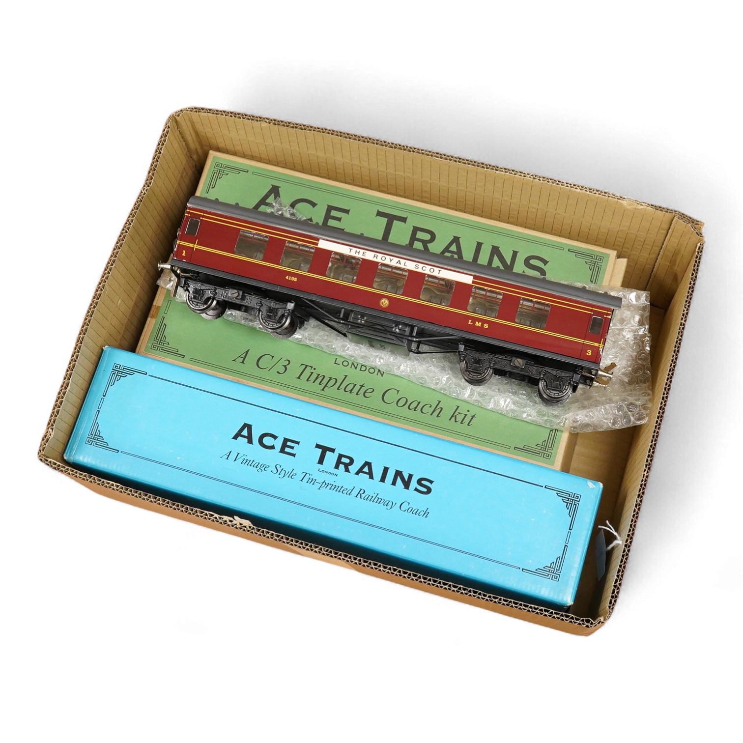 Four ACE Trains 0 gauge tinplate coaches; a boxed C/1 HRCA Brake Second, two boxed C/3 coach kits - a 3/3rd and a 3rd Brk., together with an unboxed LMS First Third composite